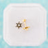 Starburst CZ Stud Earrings on a white jewelry box on a teal background