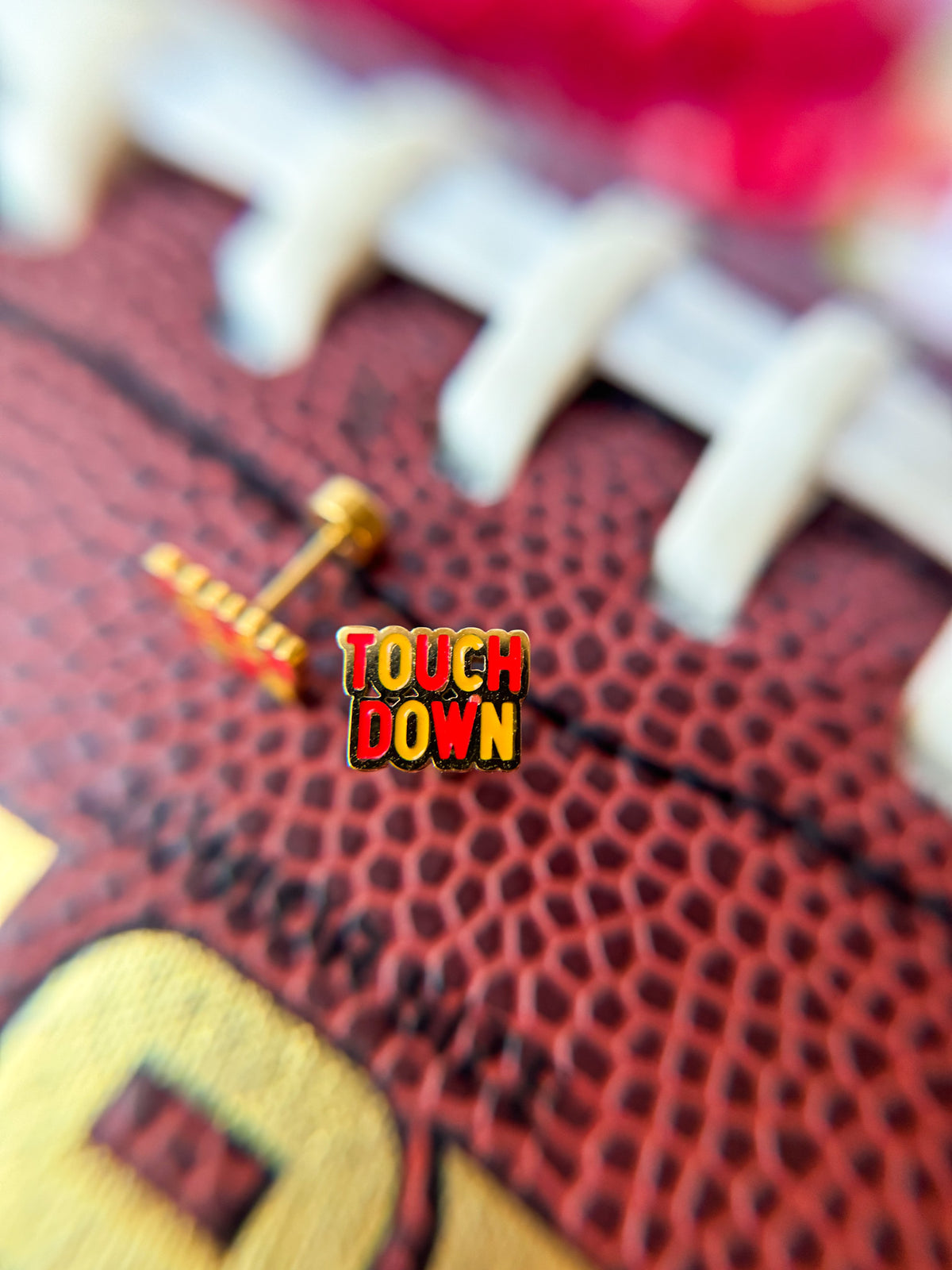 KC touchdown stud earrings close-up