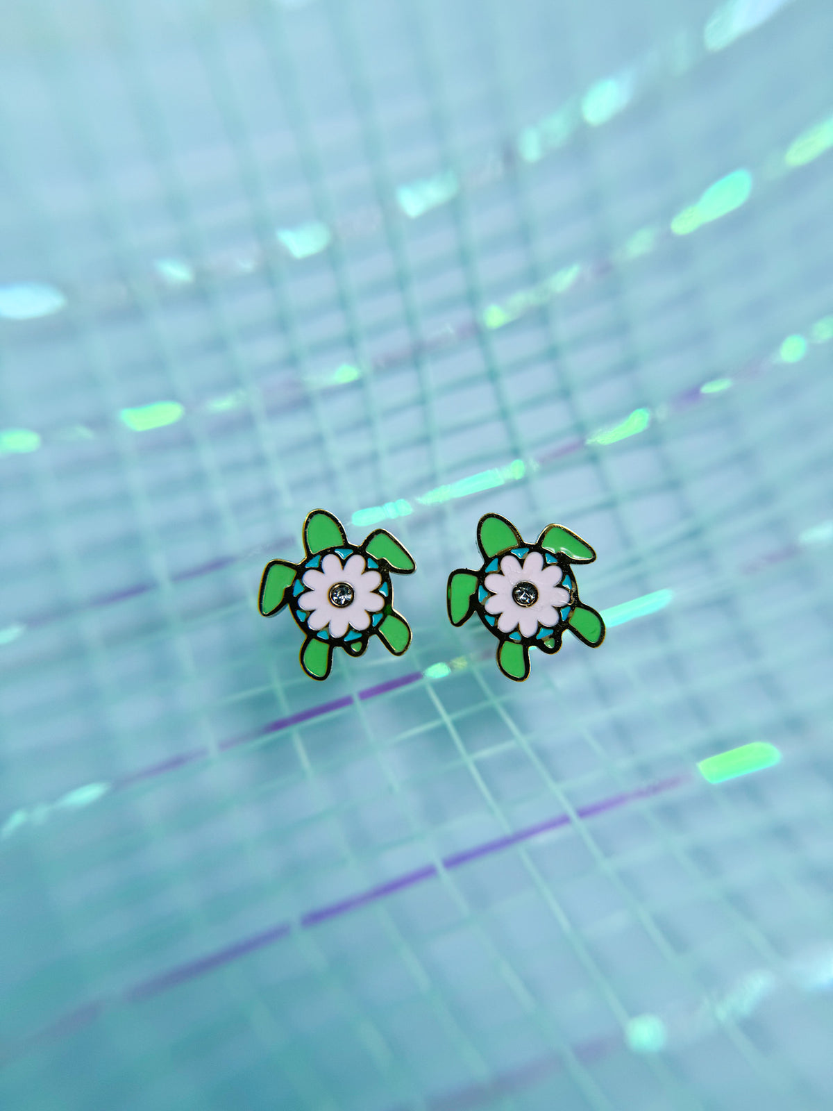 Sea turtle stud earrings close-up