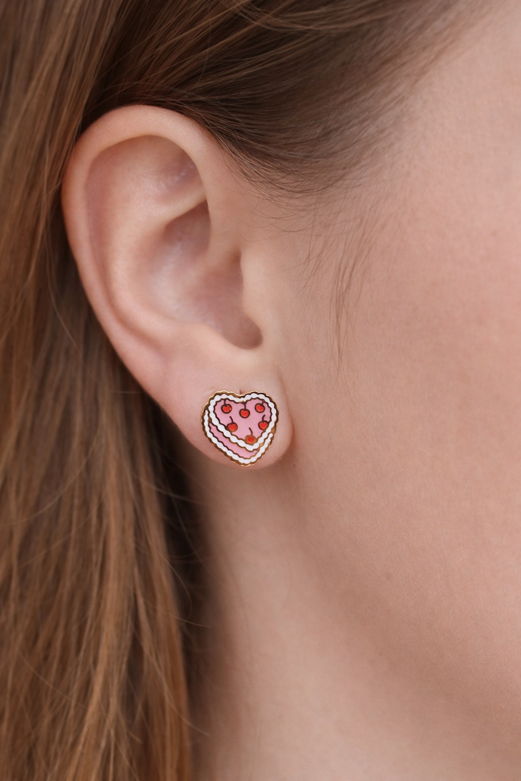 vintage heart cake stud earrings worn by young girl