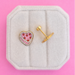vintage heart cake studs on white jewelry box with pink background
