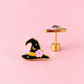 A pair of gold-tone earrings shaped like a witch's hat, featuring black enamel, a yellow band, and a pink flower, displayed on a solid pink background.