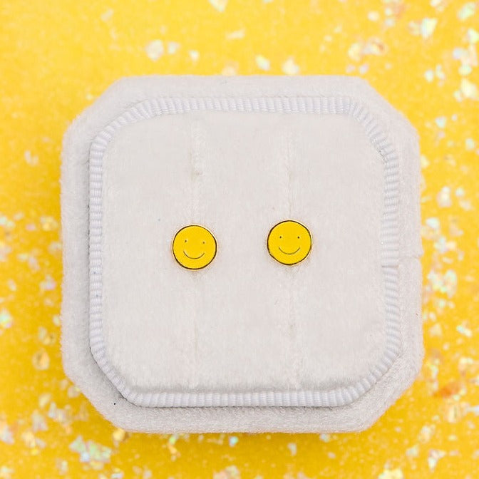 Pair of yellow smiley face stud earrings
