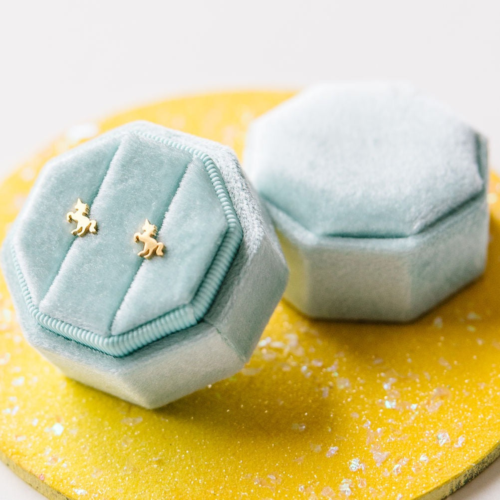 Pair of gold unicorn stud earrings